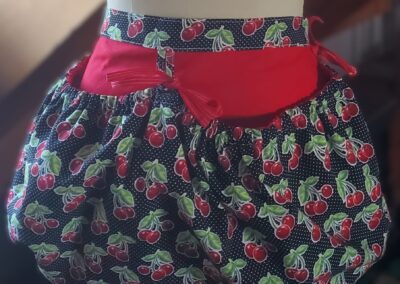 gathered cherry printed harvesting apron front
