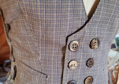 belladonna vest closeup of buttons and welt pocket