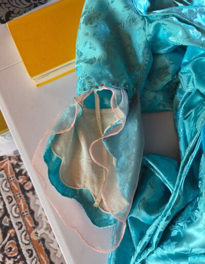 sleeve ruffles pinned to bottom of pauper dress sleeve ready for sewing