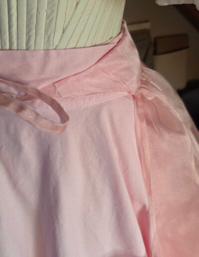 organza overskirt front tied side closeup
