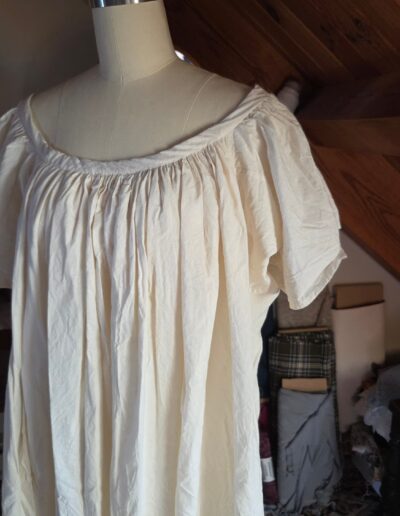 side front view of chemise displayed on dress form