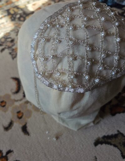 net cape displayed on mannequin head