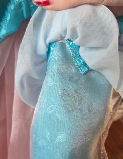 closeup of sleeve alteration and ruffle on pauper dress
