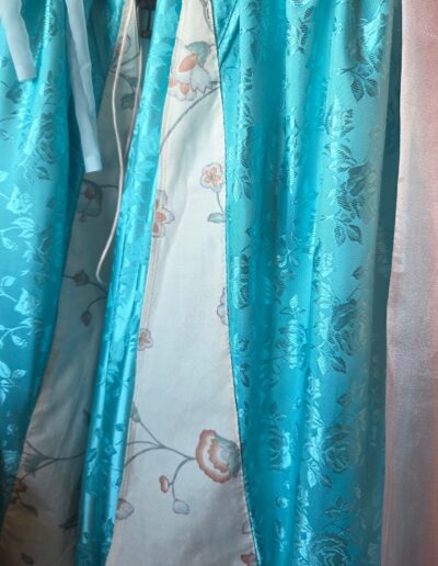 closeup of flower printed cotton panels on front of gown