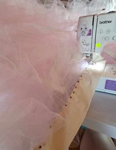 waistband of pink tulle petticoat being stitched down