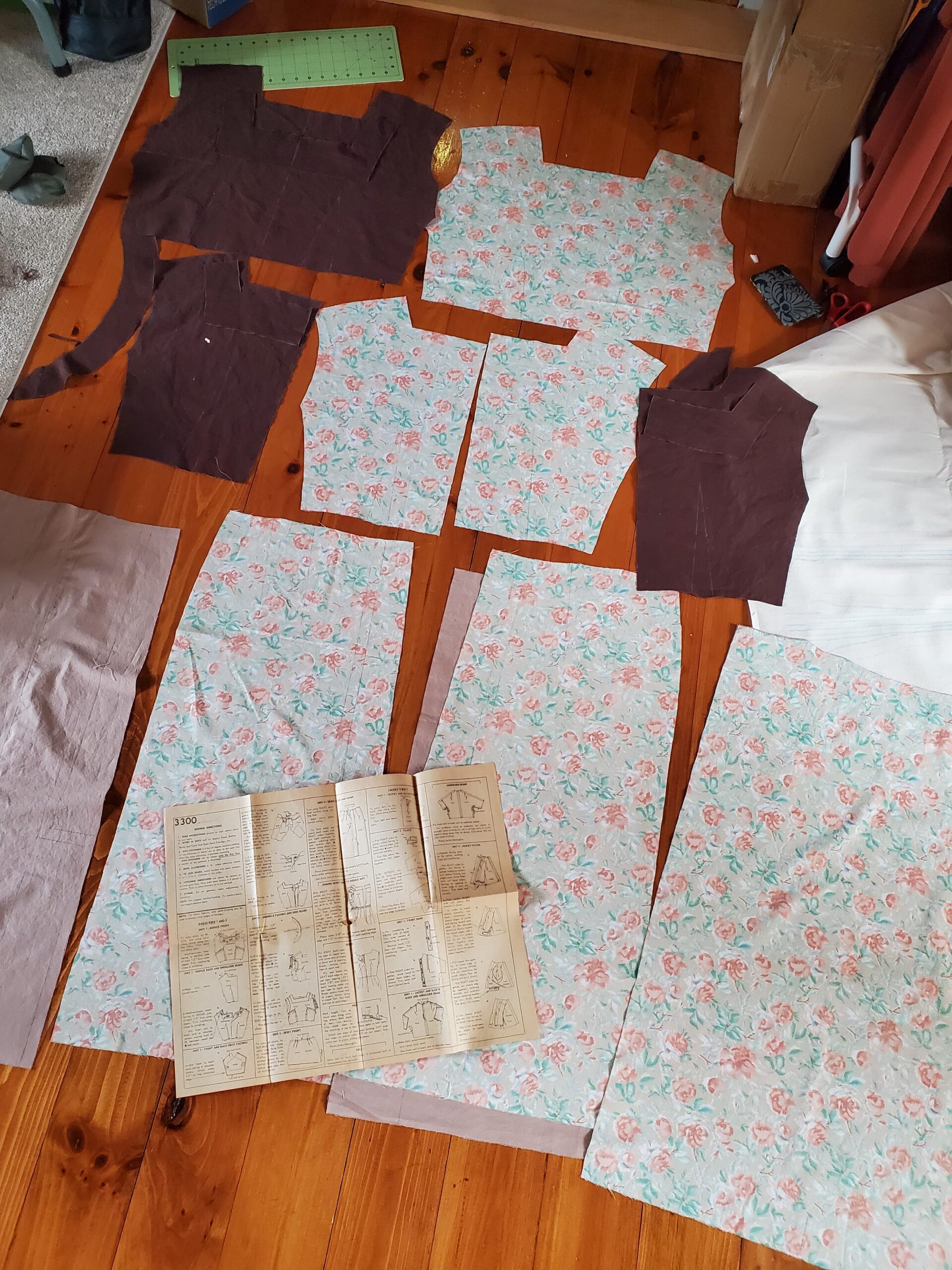 back of green peasant top with tie straps and back lacing displayed over an off white chemise