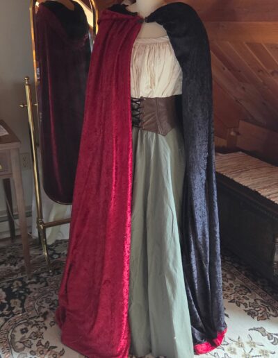 red velvet medieval cloak with black lining visible