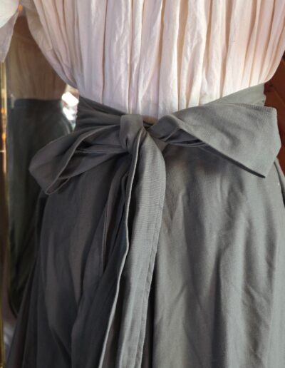 green floor length circle skirt back ties closeup